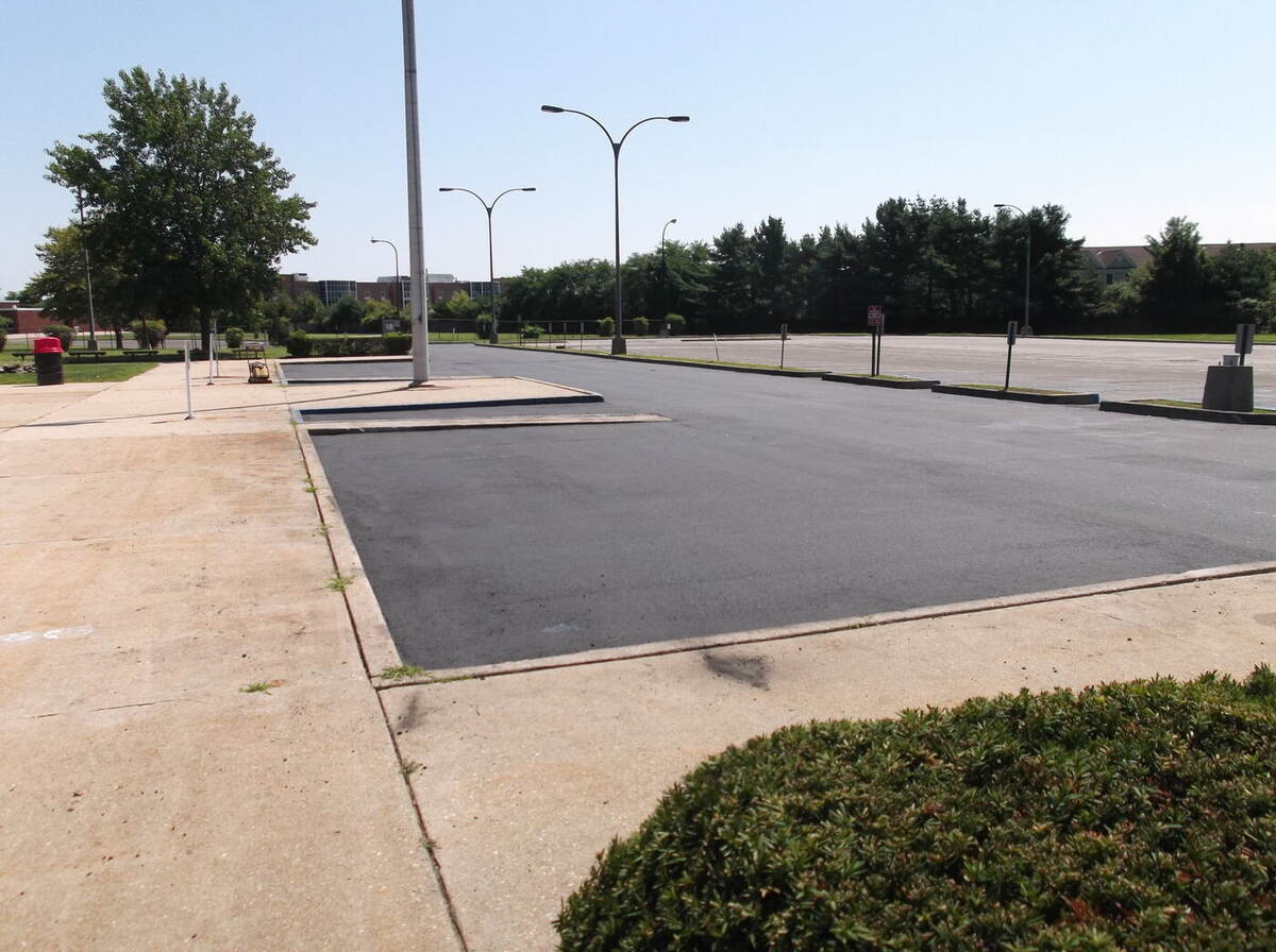 Newly paved parking lot with site lighting